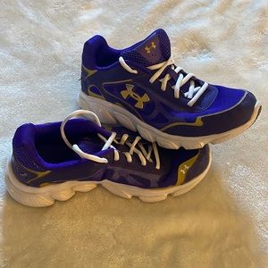 Size 4Y Under Armor purple and gold sneakers. Excellent condition. Like new